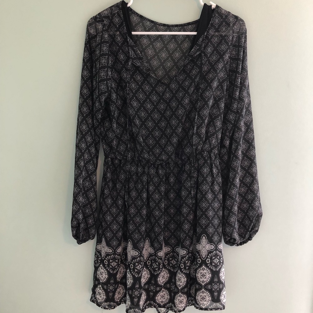 Black patterned dress, flowy.